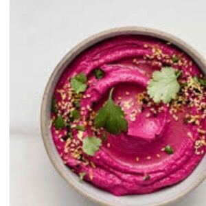 A bowl of Red Dirt Dip showcases its colourful vibrancy of beetroot.